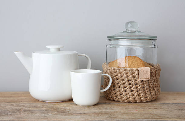 Homemade Jute Crochet Cookie Jar With Teapot and Mug stock photo