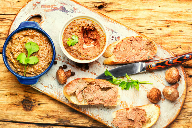 Homemade liver pate Appetizing liver pate of beef on bruschetta liver pâté photos stock pictures, royalty-free photos & images