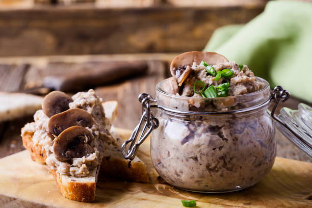 Homemade mushroom and bean paste, vegetarian food Homemade mushroom and bean paste. Pate in glass jar on rustic wooden table. Useful and healthy vegetarian food pate photos stock pictures, royalty-free photos & images
