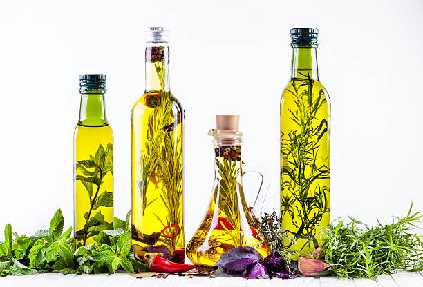 Homemade oil with herbs stock photo