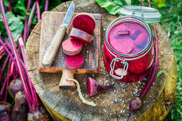 Homemade pickled beetroots with fresh ingredients stock photo