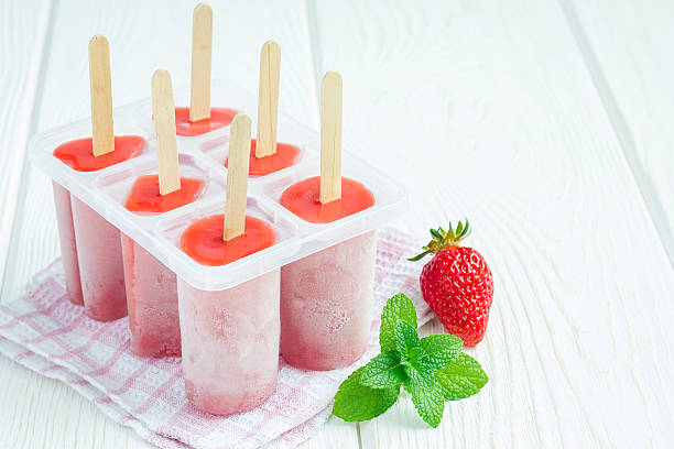 Homemade popsicles with strawberry and banana, copy space stock photo