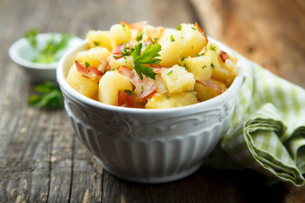 Homemade potato salad Homemade potato salad with bacon german culture stock pictures, royalty-free photos & images