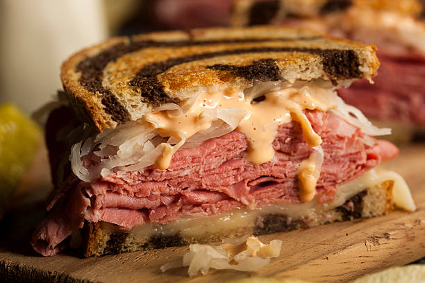 Homemade Reuben Sandwich Homemade Reuben Sandwich with Corned Beef and Sauerkraut Grilled Roast Beef Sandwich stock pictures, royalty-free photos & images