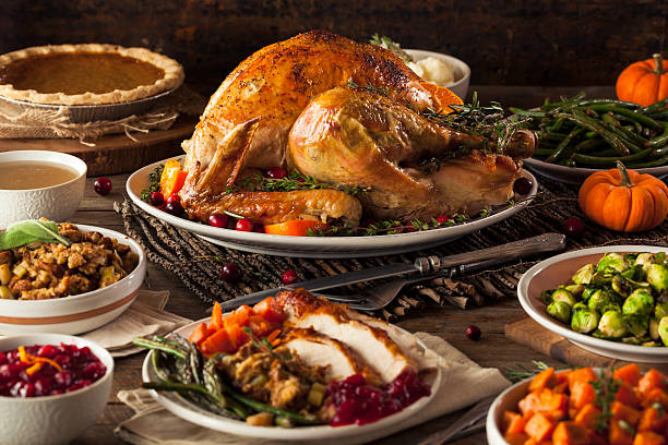 Homemade Roasted Thanksgiving Day Turkey Homemade Roasted Thanksgiving Day Turkey with all the Sides banquet photos stock pictures, royalty-free photos & images