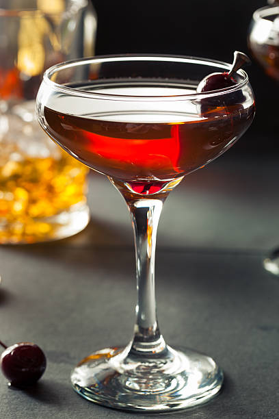 Homemade Rye Bourbon Manhattan Homemade Rye Bourbon Manhattan with a Cherry Garnish manhattan cocktail stock pictures, royalty-free photos & images