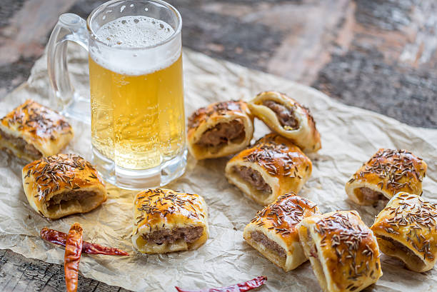 Homemade sausage rolls Homemade sausage rolls burger wrapped in paper stock pictures, royalty-free photos & images