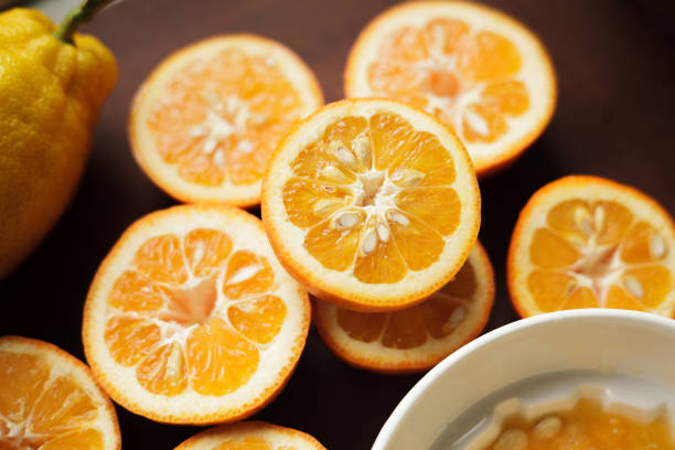 Homemade Seville bitter orange marmalade series - juicing stock photo