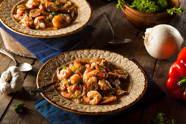 Homemade Shrimp and Sausage Cajun Gumbo Homemade Shrimp and Sausage Cajun Gumbo Over Rice gumbo stock pictures, royalty-free photos & images