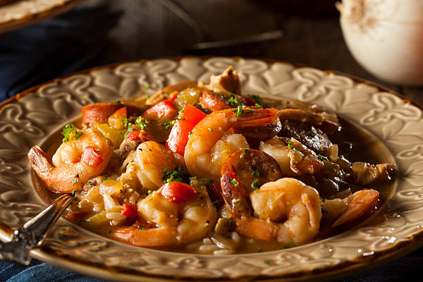 Homemade Shrimp and Sausage Cajun Gumbo Homemade Shrimp and Sausage Cajun Gumbo Over Rice gumbo stock pictures, royalty-free photos & images