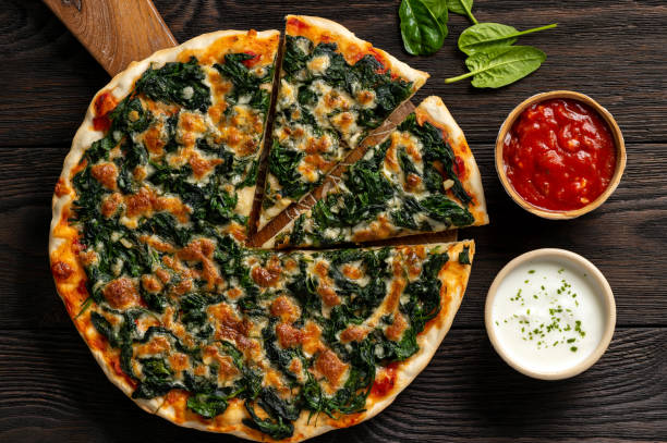 Homemade spinach pizza with mozzarella. stock photo