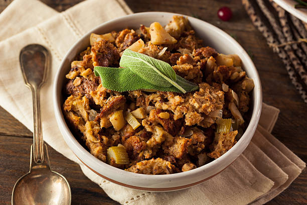 Homemade Thanksgiving Day Stuffing Homemade Thanksgiving Day Stuffing with Sage and Celery filling stock pictures, royalty-free photos & images