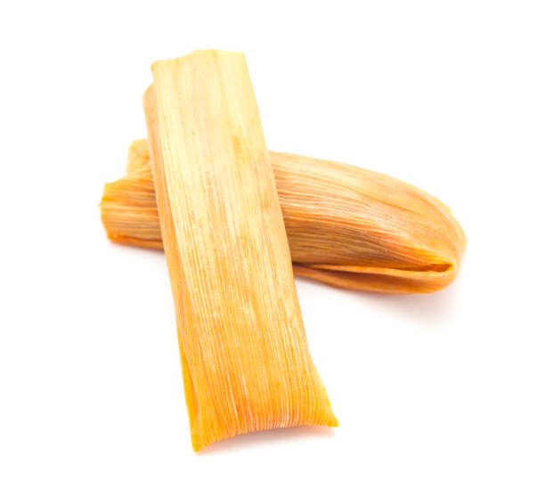 Homemade Wrapped Tamales on a White Background stock photo