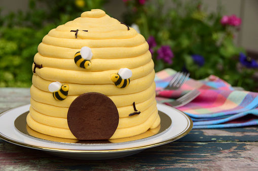 Whimsical honey and lemon beehive cake, perfect for a spring or summer celebration.
