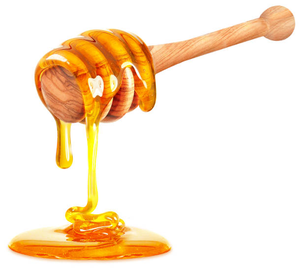 miele su sfondo bianco - miele foto e immagini stock