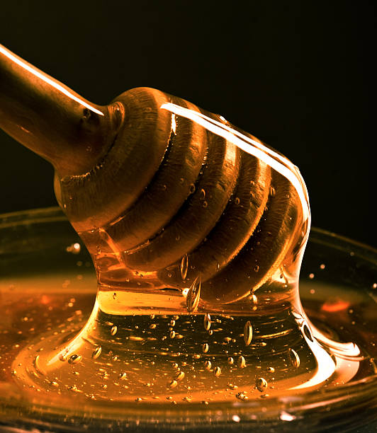 Pouring Honey Stock Photos, Pictures & Royalty-Free Images - iStock