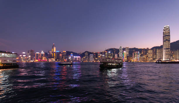 Hong Kong City Skyline with Evening Sun and orange Sky on Sunset stock photo