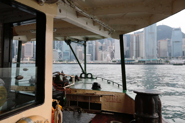 Hong Kong ferry is in operation in Victoria harbor stock photo
