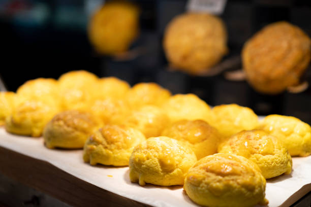 Hong Kong style baked Pineapple Bun with butter in a bakery stock photo