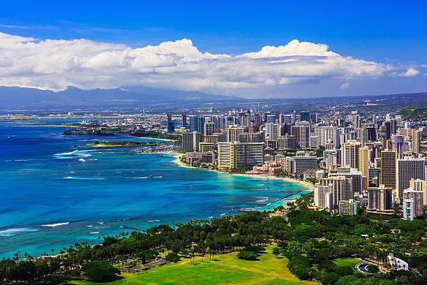 Honolulu, Hawaii Skyline of Honolulu, Hawaii and the surrounding area including the hotels and buildings on Waikiki Beach honolulu stock pictures, royalty-free photos & images