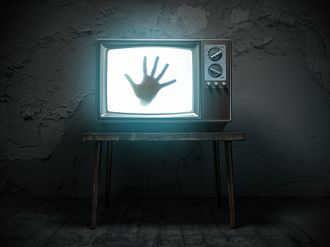Horror scary movie concept. Hand of ghost on screen of vintage tv in haunted house. 3d illustration