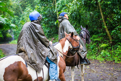 Horseback riding on foot of  Volcano Arenal, Costa Rica.