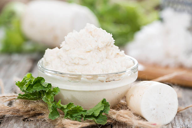 Horseradish Sauce Horseradish Sauce in a small bowl on wooden background (close-up shot) horseradish stock pictures, royalty-free photos & images