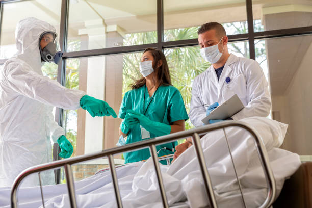Hospital Workers Attending to Young Woman in Hospital stock photo