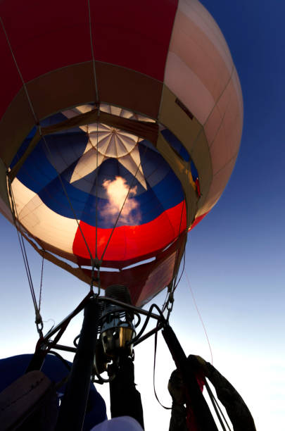 Hot air balloon at dawn preparing for take off stock photo