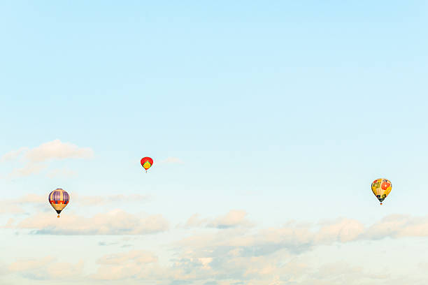 Hot air balloons above the clouds Hot air balloons above the clouds zero gravity carnival ride stock pictures, royalty-free photos & images