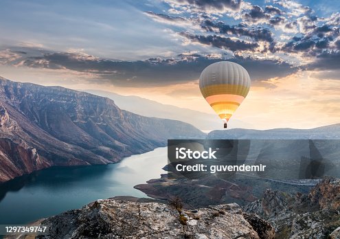 istock Hot air balloons flying over the Botan Canyon in TURKEY 1297349747