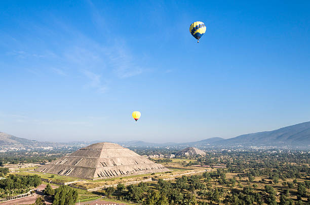 Hot air balloons in the Sun and Moon Pyramids stock photo