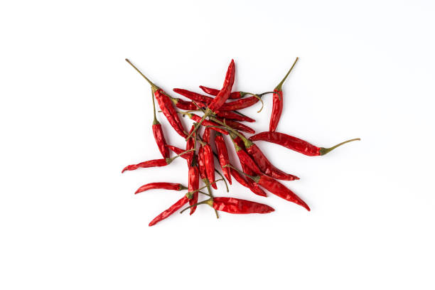 Hot chilli peppers on white background. Top view Hot chilli peppers on white background. Top view cayenne pepper stock pictures, royalty-free photos & images