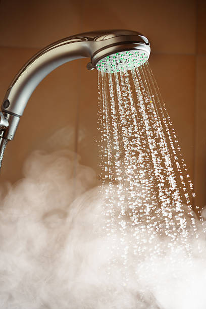 hot shower with water and steam stock photo