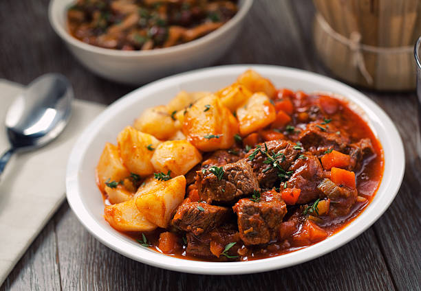 Hot stew with mushrooms and potatoes stock photo
