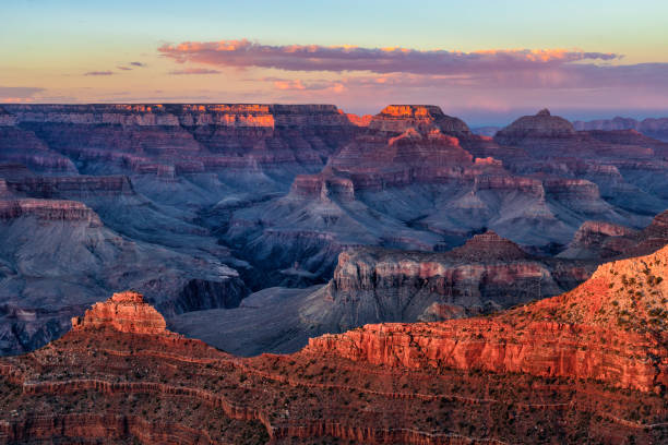 Hot summer sunset at Grand Canyon National Park The last of the light from the summer sun washes over a blazing Grand Canyon. south rim stock pictures, royalty-free photos & images