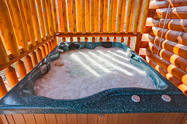 Hot Tub Heaven (XXL) Hot tub at a Log Cabin near the Smoky Mountains. sea foam stock pictures, royalty-free photos & images