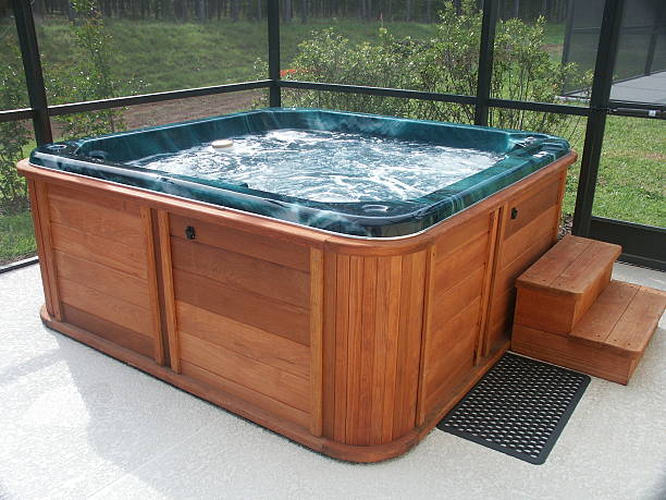 hot tub a wooden hot tub on a concrete deck, screen around hot tub stock pictures, royalty-free photos & images