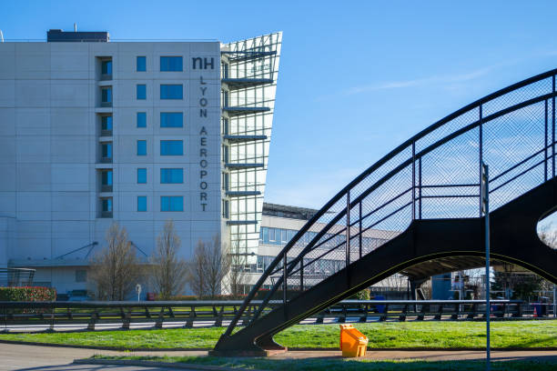 Hotel NH Lyon Airport as seen from the one of the airport's terminals, with an staircase on the right. Sleeping accommodation options at Lyon Saint Exupery International. stock photo