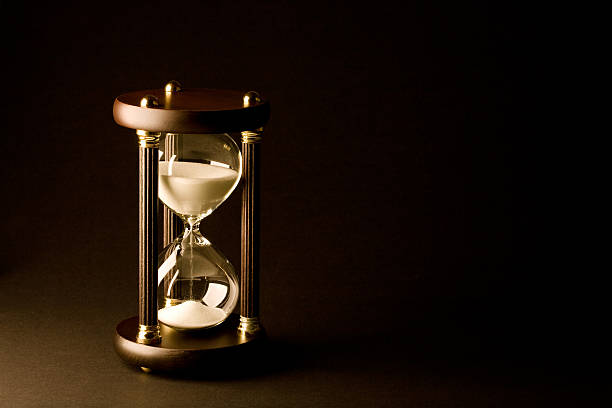 Hourglass on Black stock photo