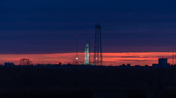 T-1 hours to launch of the Orbital ATK Antares launch vehicle Orbital ATK's Antares launch vehicle sits on launch pad 0 at the Mid-Atlantic Regional Spaceport as dawn breaks on the horizon prior to a launch to re-supply the International Space Station spaceport stock pictures, royalty-free photos & images