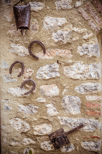 Horseshoes on a stone wall