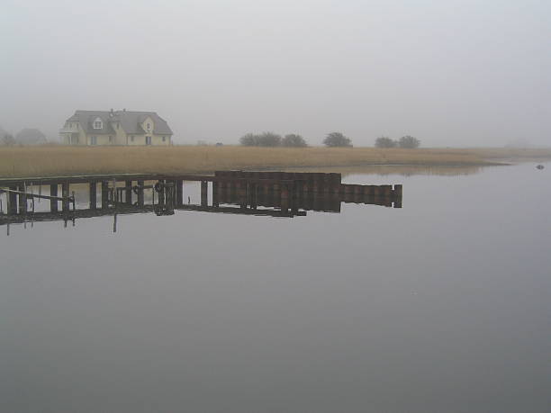 House in the fog This photo was taken on the island RÃ¼gen. r��gen stock pictures, royalty-free photos & images