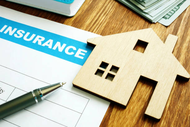 House insurance form for homeowners and model of home. home insurance claim form stock pictures, royalty-free photos & images