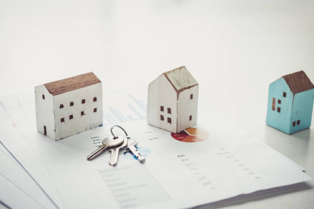 House model and key on table for finance and banking concept.Home purchase mortgage concept. stock photo