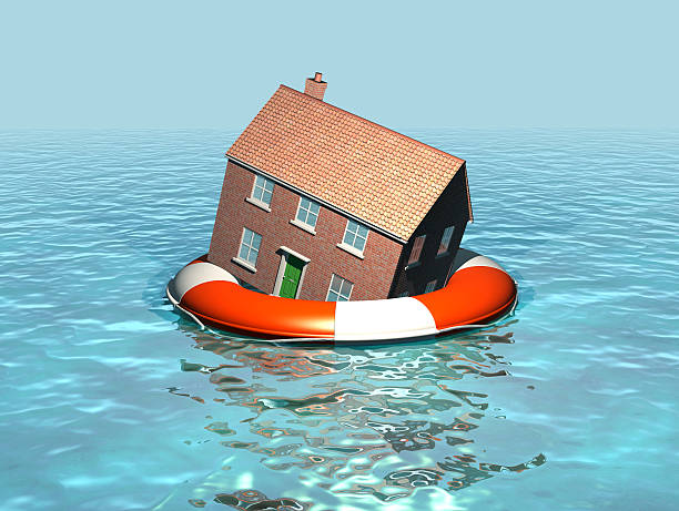 House on a lifebelt, rising sea levels, global warming stock photo