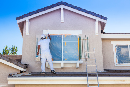 House Painter Painting The Trim And Shutters Of Home Stock Photo - Download  Image Now - iStock