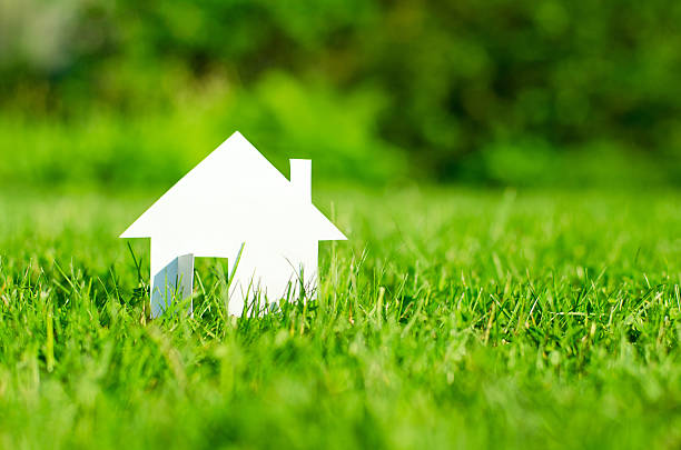 House House in green field grounds stock pictures, royalty-free photos & images