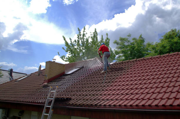 House roof cleaning with pressure tool stock photo