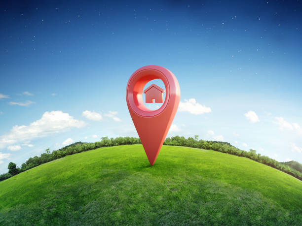 House symbol with location pin icon on earth and green grass in real estate sale or property investment concept, Buying new home for family stock photo